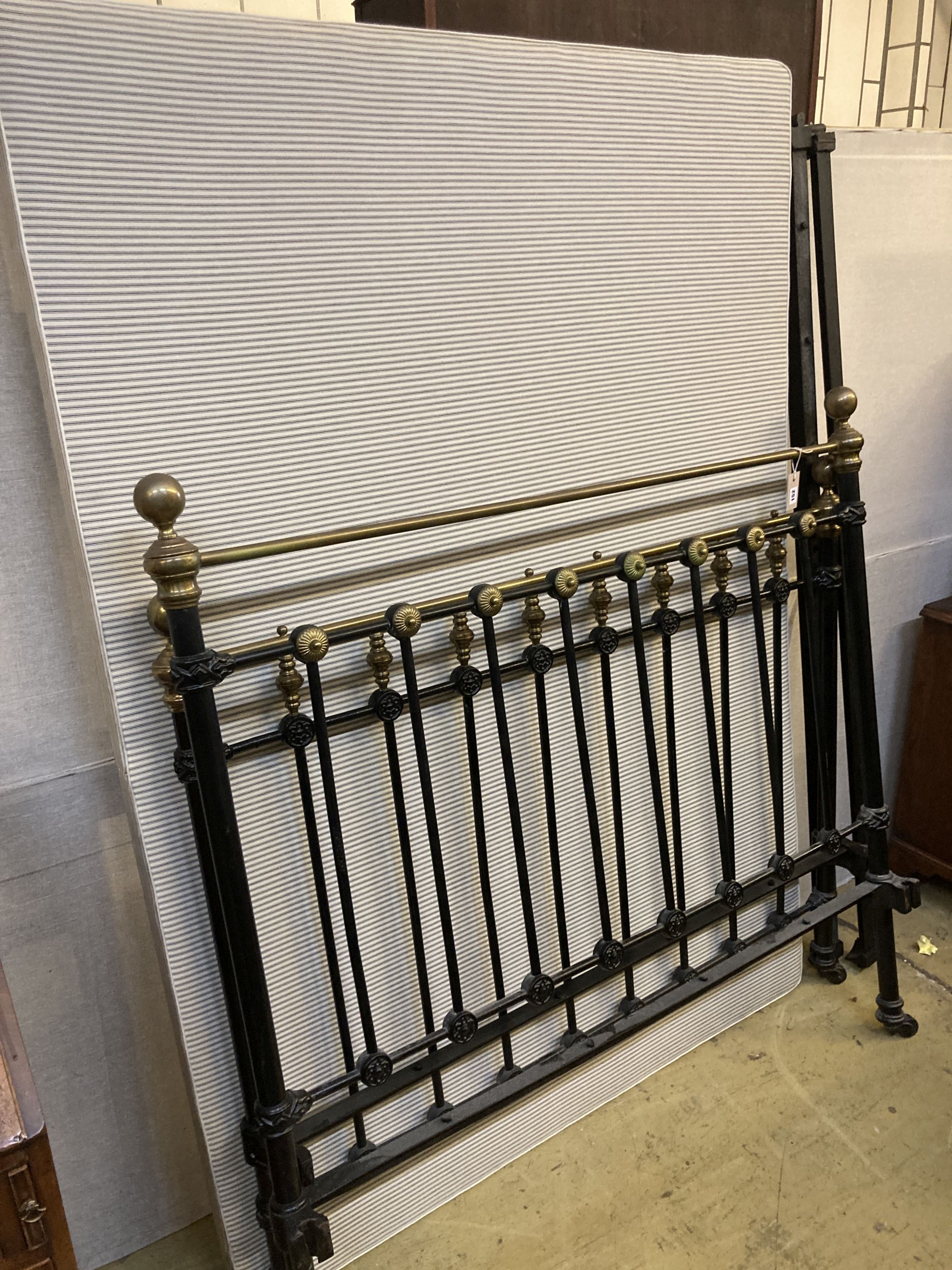 A Victorian style brass and iron double bed frame, width 4ft. 6in., height 140cm